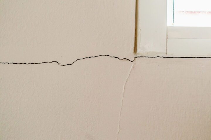 New house wall crack near window frame